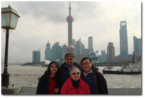Laura with Marty, her mother, and Larry in Shanghai.